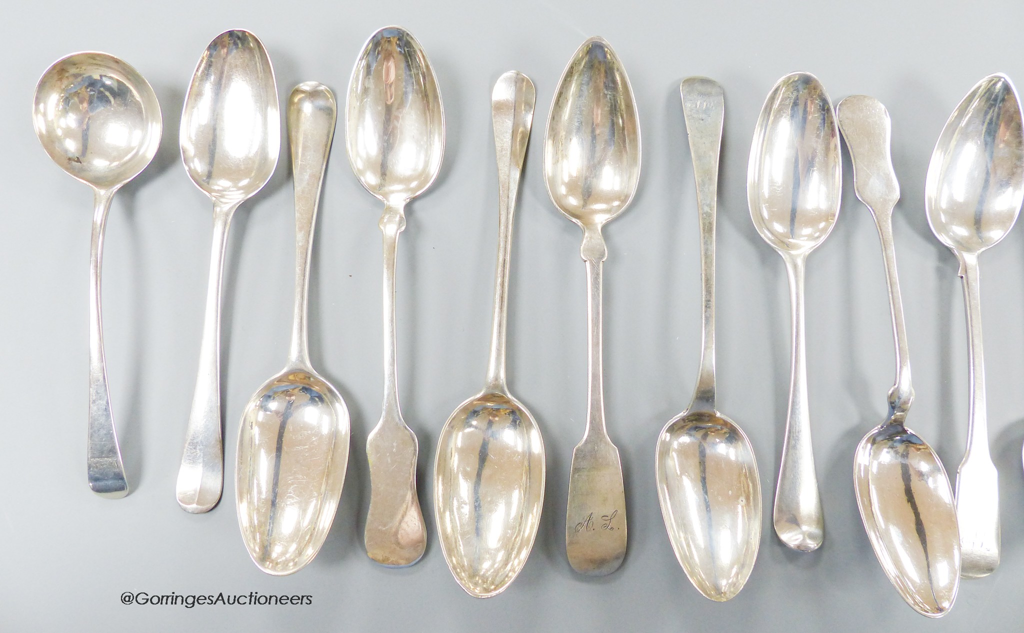 Ten assorted 18th century silver tablespoons and a similar sauce ladle, various pattern, dates and makers and six 19th century continental white metal tablespoons, gross 32.5oz.